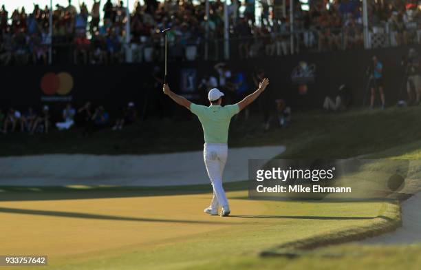 Rory McIlroy of Northern Ireland celebrates after making his birdie putt on the 18th green during the final round at the Arnold Palmer Invitational...