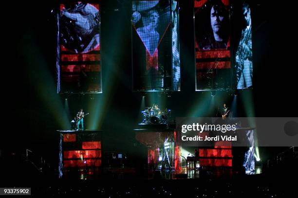 Matt Bellamy, Dominic Howard and Christopher Wolstenholme perform on stage at Palau Sant Jordi on November 24, 2009 in Barcelona, Spain.