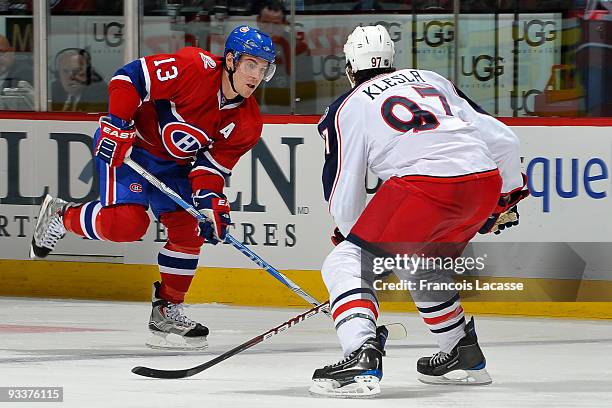 Mike Cammalleri of the Montreal Canadiens handles the puck in front of Rostislav Klesla of the Colombus Blue Jackets on November 24, 2009 at the Bell...