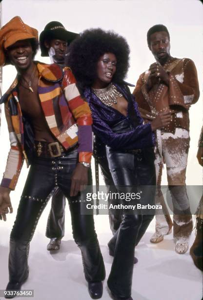 Jamaican-born model Grace Jones and members of American Funk, R&B, and Rock group the Chambers Brothers pose in front of white background, New York,...