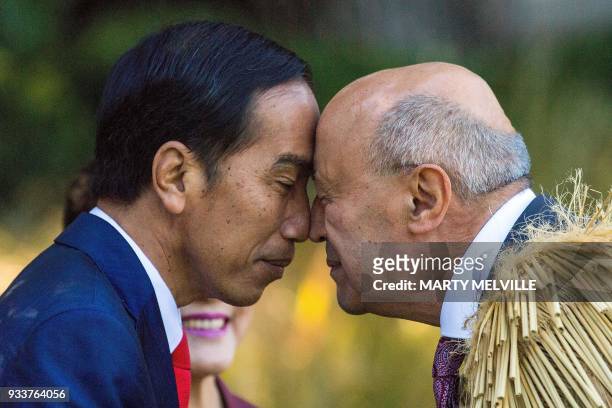 Indonesian President Joko Widodo receives a Maori Hongi from a Maori elder during ceremony of welcome for Widodo at Government House in Wellington,...