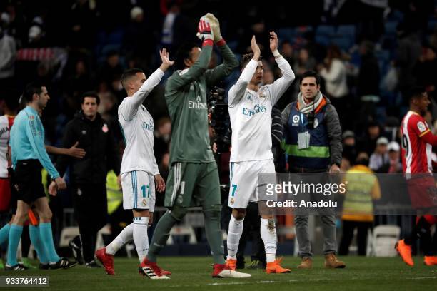 Keylor Navas , Lucas Vazquez and Cristiano Ronaldo of Real Madrid celebrate after the La Liga soccer match between Real Madrid and Girona at Santiago...