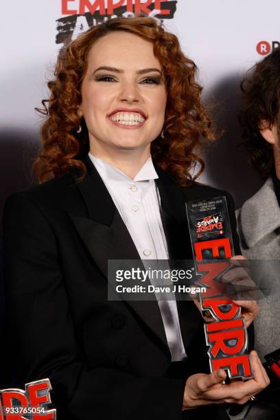 Daisy Ridley, winner of the Best Film award for 'Star Wars: The Last Jedi', poses in the winners room at the Rakuten TV EMPIRE Awards 2018 at The...