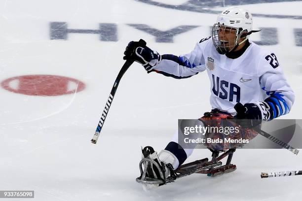 Rico Roman of the United States celebrates winning the gold medal over Canada in the Ice Hockey gold medal game between United States and Canada...