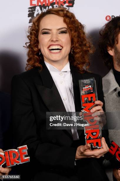 Daisy Ridley, winner of the Best Film award for 'Star Wars: The Last Jedi', poses in the winners room at the Rakuten TV EMPIRE Awards 2018 at The...