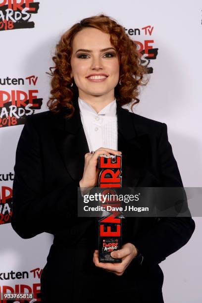 Daisy Ridley, winner of the Best Film award for 'Star Wars: The Last Jedi', poses in the winners room at the Rakuten TV EMPIRE Awards 2018 at The...