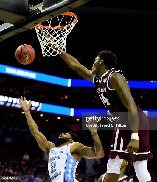 Robert Williams of the Texas A&M Aggies blocks a shot by Joel Berry II of the North Carolina Tar Heels during the second round of the 2018 NCAA Men's...