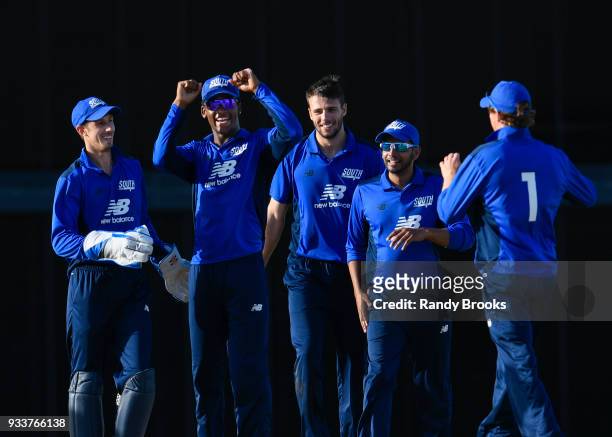 John Simpson , Delray Rawlins , Tom Barber and Ravi Patel of South celebrates the dismissal of Steven Mullaney of North during the ECB North v South...