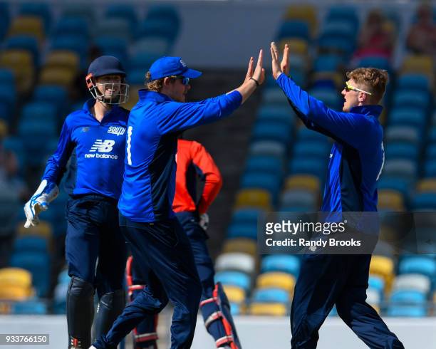 Sam Northeast , John Simpson and Dominic Bess celebrate the dismissal of Keaton Jennings of North during the ECB North v South Series match One at...