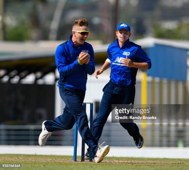 Dominic Bess and Ollie Pope of South celebrates the dismissal of Joe Clarke of North during the ECB North v South Series match One at Kensington Oval...