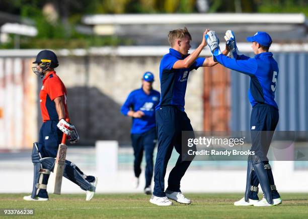 Sam Curran and John Simpson of South celebrates the dismissal of Brett D'Oliveira of North during the ECB North v South Series match One at...