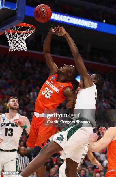 Bourama Sidibe of the Syracuse Orange shoots the ball against Jaren Jackson Jr. #2 of the Michigan State Spartans during the second half in the...