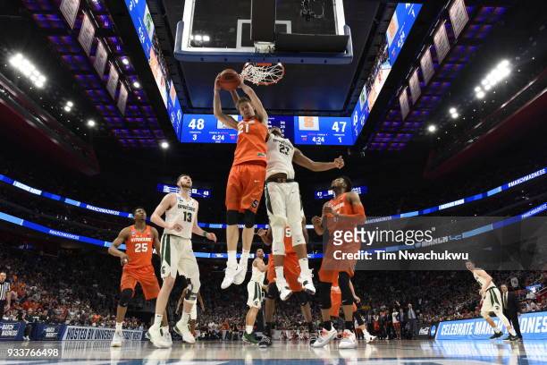 Marek Dolezaj of the Syracuse Orange and Miles Bridges of the Michigan State Spartans go compete for a rebound in the second round of the 2018 NCAA...