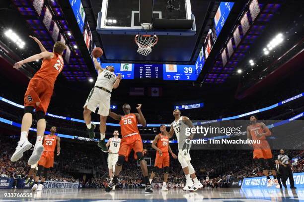 Miles Bridges of the Michigan State Spartans goes up for a dunk over the Syracuse Orange in the second round of the 2018 NCAA Photos via Getty Images...