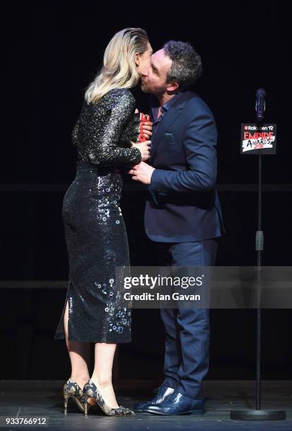 Actor Eddie Marsan presents actress Vanessa Kirby with the award for Best TV Series for 'The Crown' on stage during the Rakuten TV EMPIRE Awards 2018...