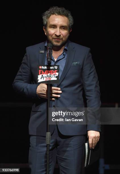 Actor Eddie Marsan presents the award for Best TV Series on stage during the Rakuten TV EMPIRE Awards 2018 at The Roundhouse on March 18, 2018 in...