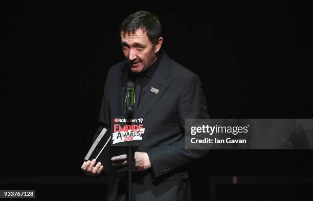 Actor Ralph Ineson presents the award for Best Horror on stage during the Rakuten TV EMPIRE Awards 2018 at The Roundhouse on March 18, 2018 in...