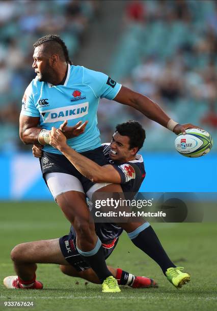 Taqele Naiyaravoro of the Waratahs is tackled by Jack Debreczeni of the Rebels during the round five Super Rugby match between the Waratahs and the...