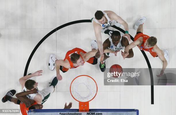 Joshua Langford of the Michigan State Spartans battles for a rebound against the Syracuse Orange in the second round of the 2018 NCAA Men's...