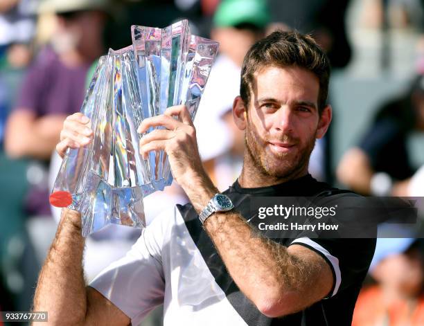 Juan Martin Del Potro of Argentina poses with the trophy after his victory over Roger Federer of Switzerland in the ATP final during the BNP Paribas...