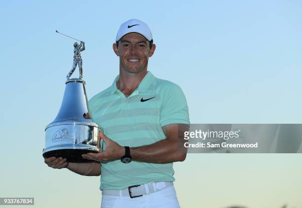 Rory McIlroy of Northern Ireland holds the trophy after his two shot victory during the final round at the Arnold Palmer Invitational Presented By...