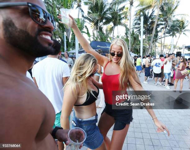 Students on Spring Break dance to DJ music during the launch pool party produced by 93.5FM Revolution Radio Miami at the Nationl Hotel on South Beach...