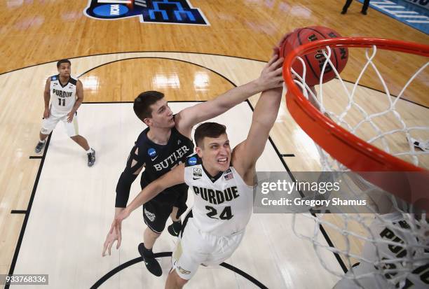 Nate Fowler of the Butler Bulldogs defends a shot by Grady Eifert of the Purdue Boilermakers in the second round of the 2018 NCAA Men's Basketball...