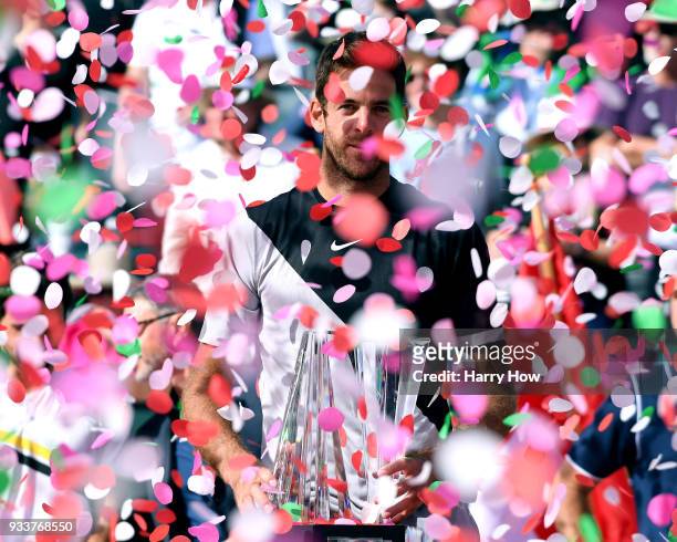 Juan Martin Del Potro of Argentina poses with the trophy after his victory over Roger Federer of Switzerland in the ATP final during the BNP Paribas...