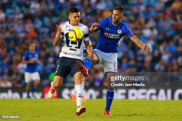 David Cabrera of Pumas fights for the ball with Edgar Mendez of Cruz Azul during the 12th round match between Cruz Azul and Pumas UNAM as part of the...