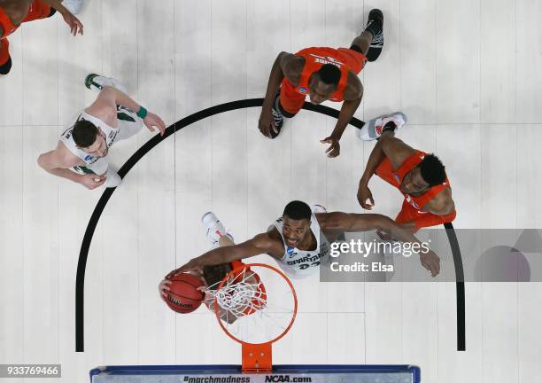 Xavier Tillman of the Michigan State Spartans defends a shot against the Syracuse Orange in the second round of the 2018 NCAA Men's Basketball...