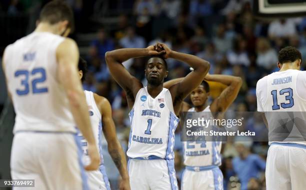 Theo Pinson and teammate Kenny Williams of the North Carolina Tar Heels react at the end of their game against the Texas A&M Aggies during the second...
