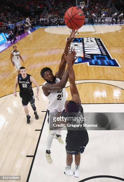 Jacquil Taylor of the Purdue Boilermakers shoots the ball against Kelan Martin of the Butler Bulldogs in the second round of the 2018 NCAA Men's...