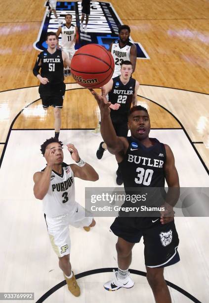 Kelan Martin of the Butler Bulldogs shoots the ball against Carsen Edwards of the Purdue Boilermakers in the second round of the 2018 NCAA Men's...