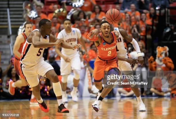 Marcquise Reed of the Clemson Tigers reaches to control the ball against Mustapha Heron of the Auburn Tigers in the first half during the second...