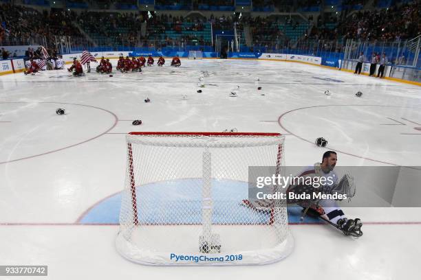 Goalkeeper Steve Cash of the United States celebrates winning the gold medal over Canada in the Ice Hockey gold medal game between United States and...