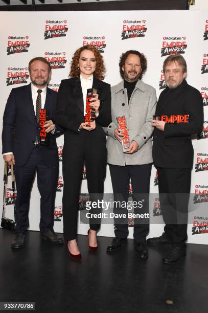 Rian Johnson, Daisy Ridley, Ram Bergman and Mark Hamill pose in the winners room at the Rakuten TV EMPIRE Awards 2018 at The Roundhouse on March 18,...