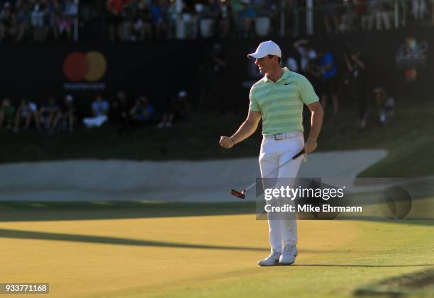 Rory McIlroy of Northern Ireland celebrates after making his birdie putt on the 18th green during the final round at the Arnold Palmer Invitational...