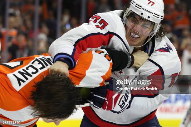 Oshie of the Washington Capitals and Travis Konecny of the Philadelphia Flyers fight during the third period at Wells Fargo Center on March 18, 2018...