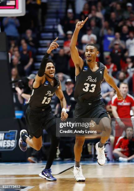 Josh Hall of the Nevada Wolf Pack celebrates with Hallice Cooke after defeating the Cincinnati Bearcats during the second half in the second round of...