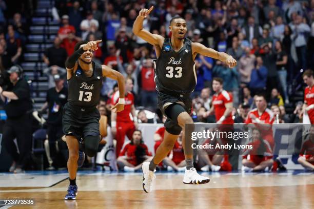 Josh Hall of the Nevada Wolf Pack celebrates with Hallice Cooke after defeating the Cincinnati Bearcats during the second half in the second round of...