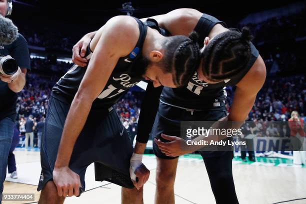 Caleb Martin celebrates with Cody Martin of the Nevada Wolf Pack after defeating the Cincinnati Bearcats in the second round of the 2018 Men's NCAA...