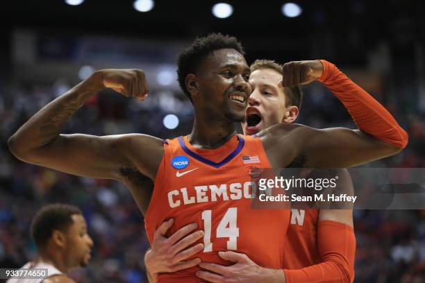 Elijah Thomas celebrates with David Skara of the Clemson Tigers as they take on the Auburn Tigers in the first half during the second round of the...