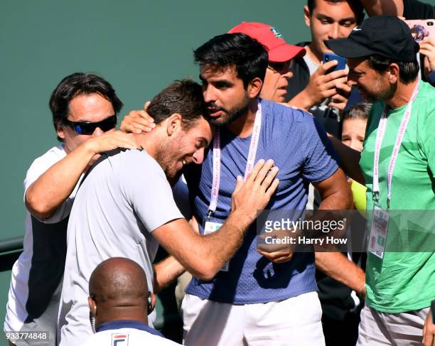 Juan Martin Del Potro of Argentina celebrates victory over Roger Federer of Switzerland with members of his team in the ATP final during the BNP...