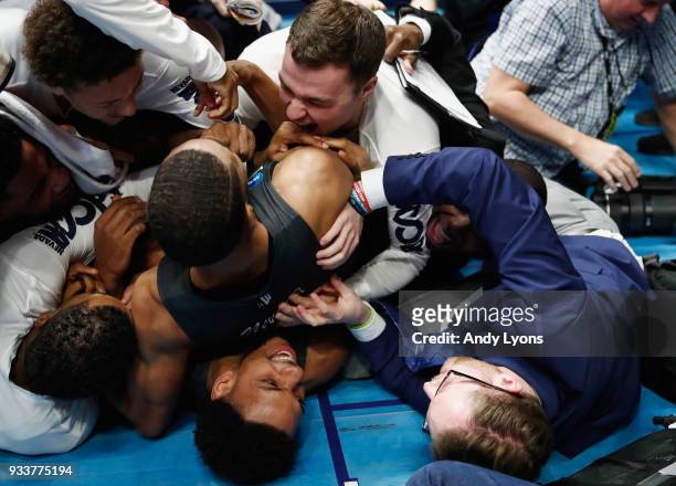 The Nevada Wolf Pack celebrate after defeating the Cincinnati Bearcats in the second round of the 2018 Men's NCAA Basketball Tournament at...