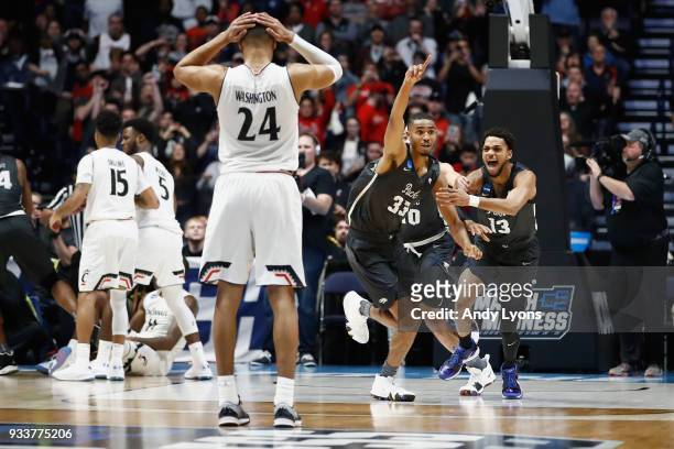 Josh Hall of the Nevada Wolf Pack celebrates with Hallice Cooke after defeating the Cincinnati Bearcats during the second half in the second round of...