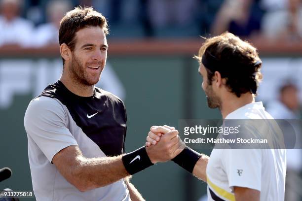 Juan Martin Del Potro of Argentina is congratulated by Roger Federer of Switzerland after their match during the men's final on Day 14 of the BNP...