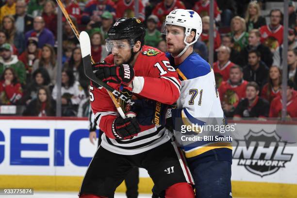 Artem Anisimov of the Chicago Blackhawks and Vladimir Sobotka of the St. Louis Blues watch for the puck in the first period at the United Center on...