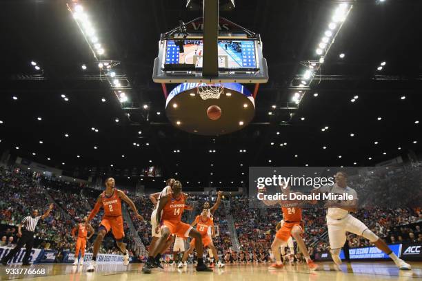 Marcquise Reed, Elijah Thomas, Scott Spencer and David Skara of the Clemson Tigers box out as they watch the basket against the Auburn Tigers in the...