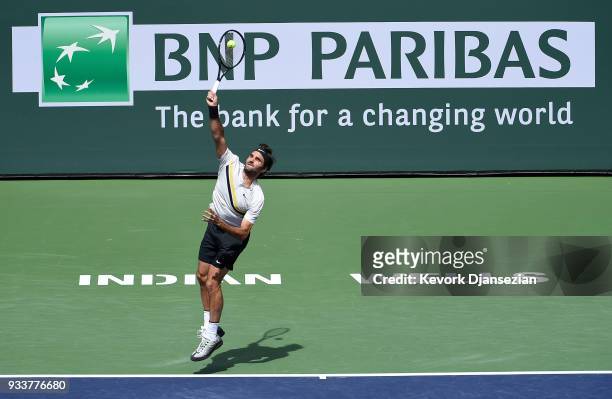 Roger Federer of Switzerland serves against Juan Martin Del Potro of Argentina during the men's final on Day 14 of BNP Paribas Open on March 18, 2018...