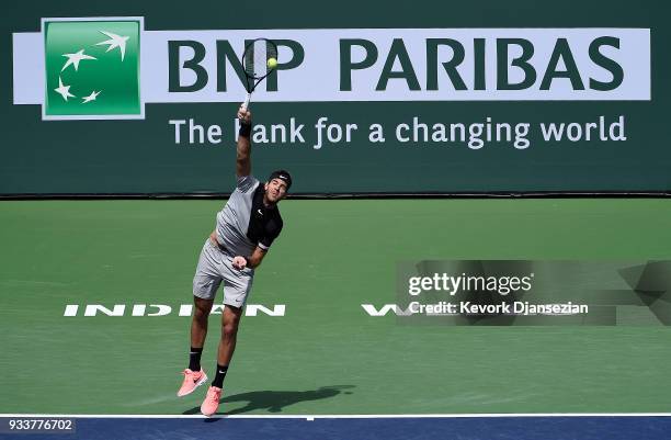 Juan Martin Del Potro of Argentina serves against Roger Federer of Switzerland during the men's final on Day 14 of BNP Paribas Open on March 18, 2018...